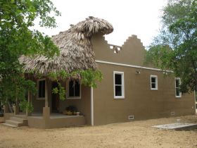 Belize home built of Insulated concrete form construction with a traditional Mayan thatched roof – Best Places In The World To Retire – International Living